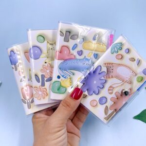 Mini Caderno Gatinho Capa c/ Fechamento e Mini Caneta - UND