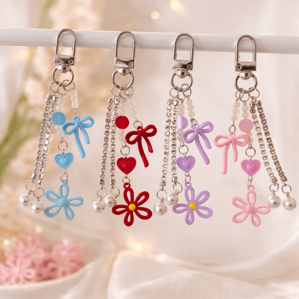 Chaveiro Tendência Charm Flor Lacinho  - IMPORTADO - UND