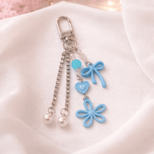 Chaveiro Tendência Charm Flor Lacinho  - IMPORTADO - UND