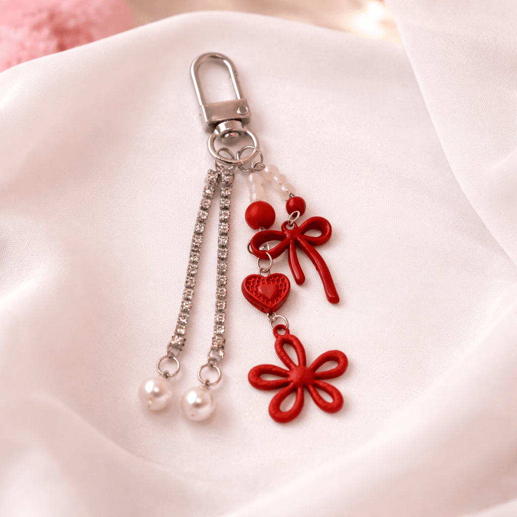 Chaveiro Tendência Charm Flor Lacinho  - IMPORTADO - UND